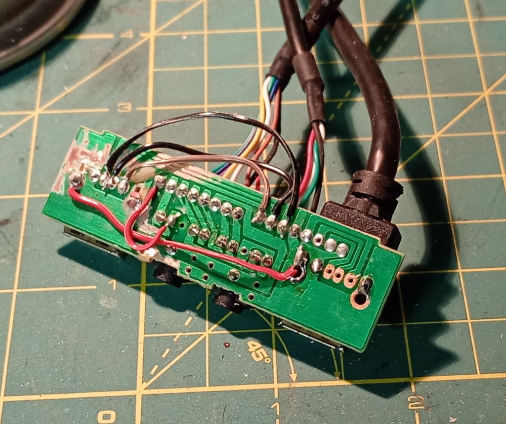 The PCB is put back together, but it has been repaired by incompetently soldered wires that nevertheless will probably outlive the usefulness of the case they are part of.