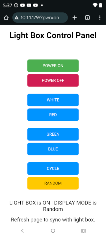 Screengrab from a phone. It is a webpage consisting of the title Light Box Control Panel and a series of buttons arranged vertically. The top button is green with the label Power On. Next is a reddish button titled power off. Then there are five blue buttons titled White, Red, Green, Blue, Cycle. The bottom button is yellow, because it is selected. It is labeled Random.